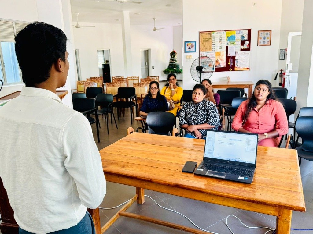 A facilitator working with local entrepreneurs during a programme session