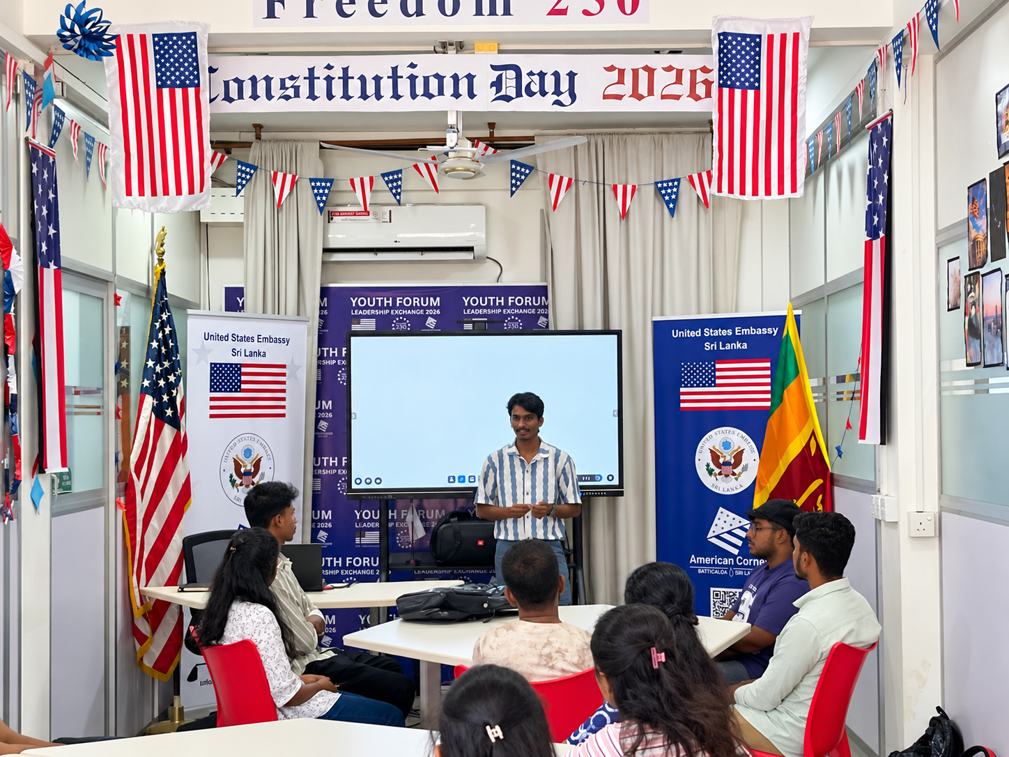 Participants at a youth workshop in Batticaloa, with a facilitator speaking at the front